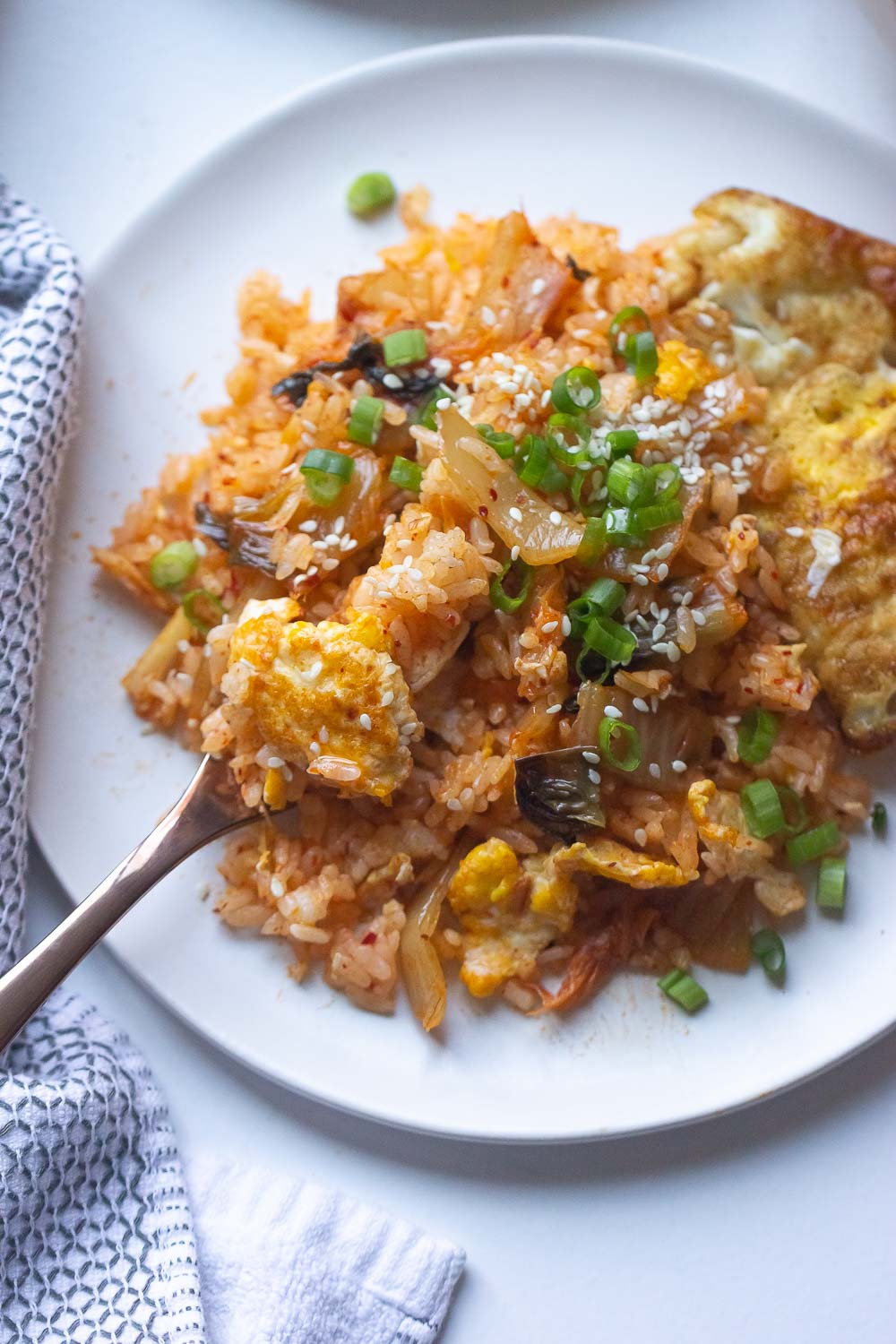 This Kimchi Fried Rice is so easy to make and a great way to use up your day-old rice. Make it a low-carb option with cauliflower rice for a healthy vegan dinner side. 