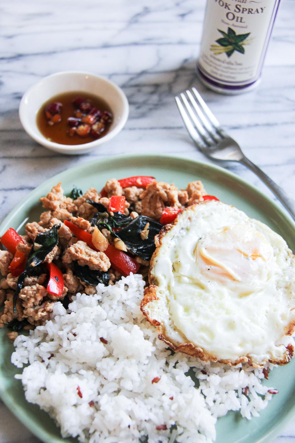 This quick & easy Thai Basil Chicken is budget friendly, light and full of flavor - all blend in a perfect flavor combination. Great for busy weekday meals and can be done in less than 20 minutes.