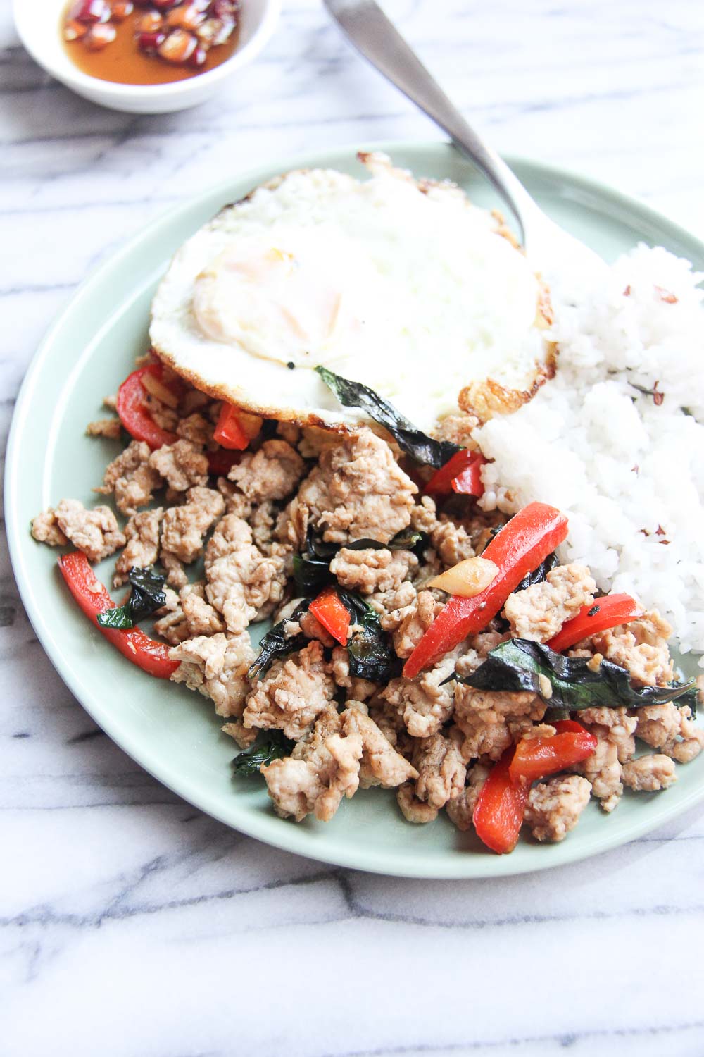 This quick & easy Thai Basil Chicken is budget friendly, light and full of flavor - all blend in a perfect flavor combination. Great for busy weekday meals and can be done in less than 20 minutes.