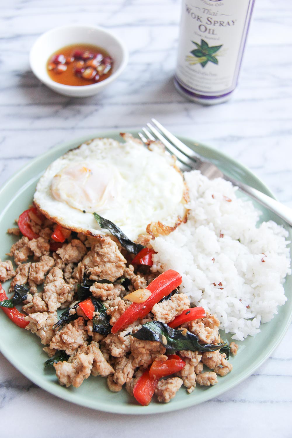 This quick & easy Thai Basil Chicken is budget friendly, light and full of flavor - all blend in a perfect flavor combination. Great for busy weekday meals and can be done in less than 20 minutes.