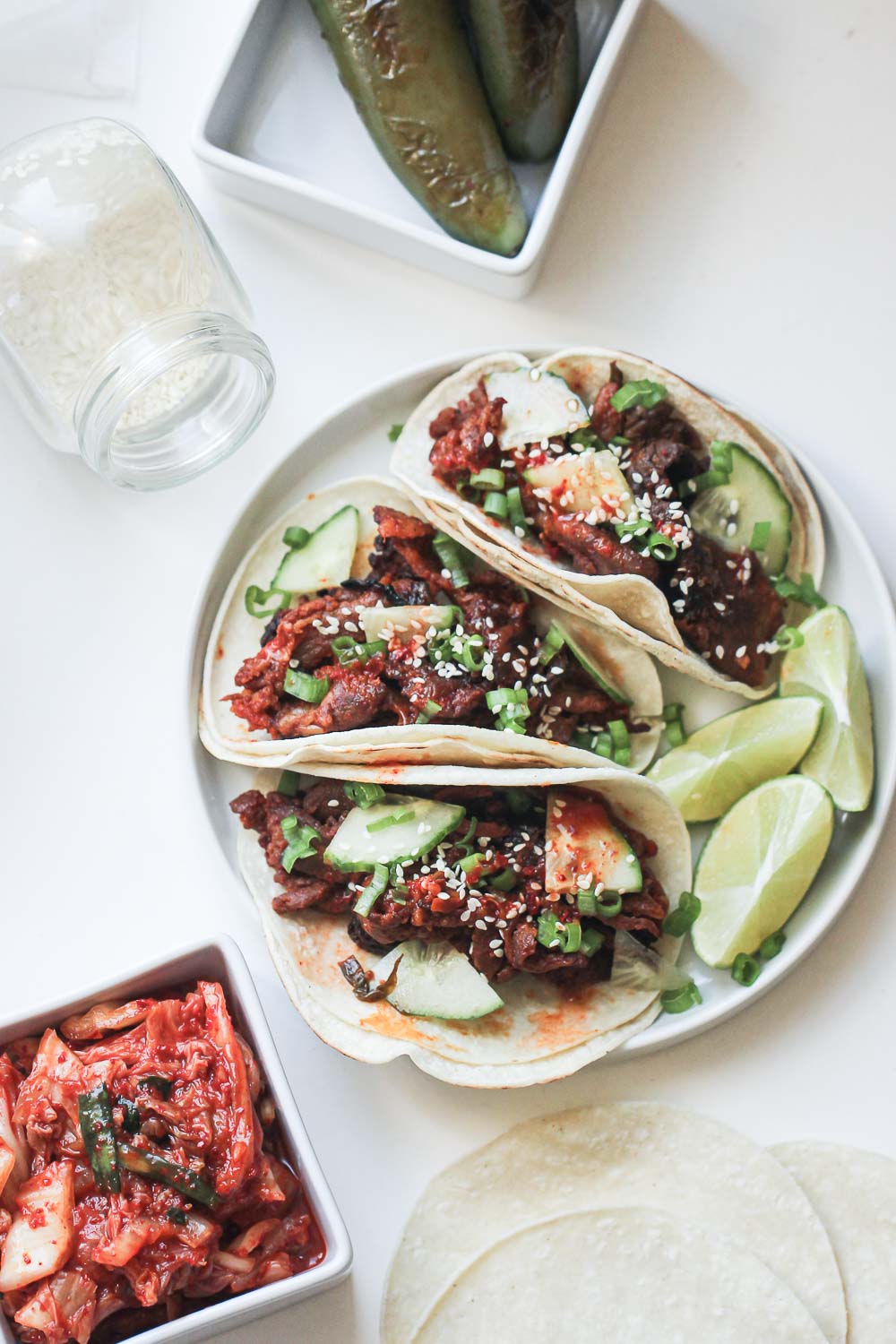 Juicy, sweet and spicy Korean pork tacos topped with fresh kimchi and the most finger licking good gochujang sauce all on a tortilla. Make the best tacos of your life!