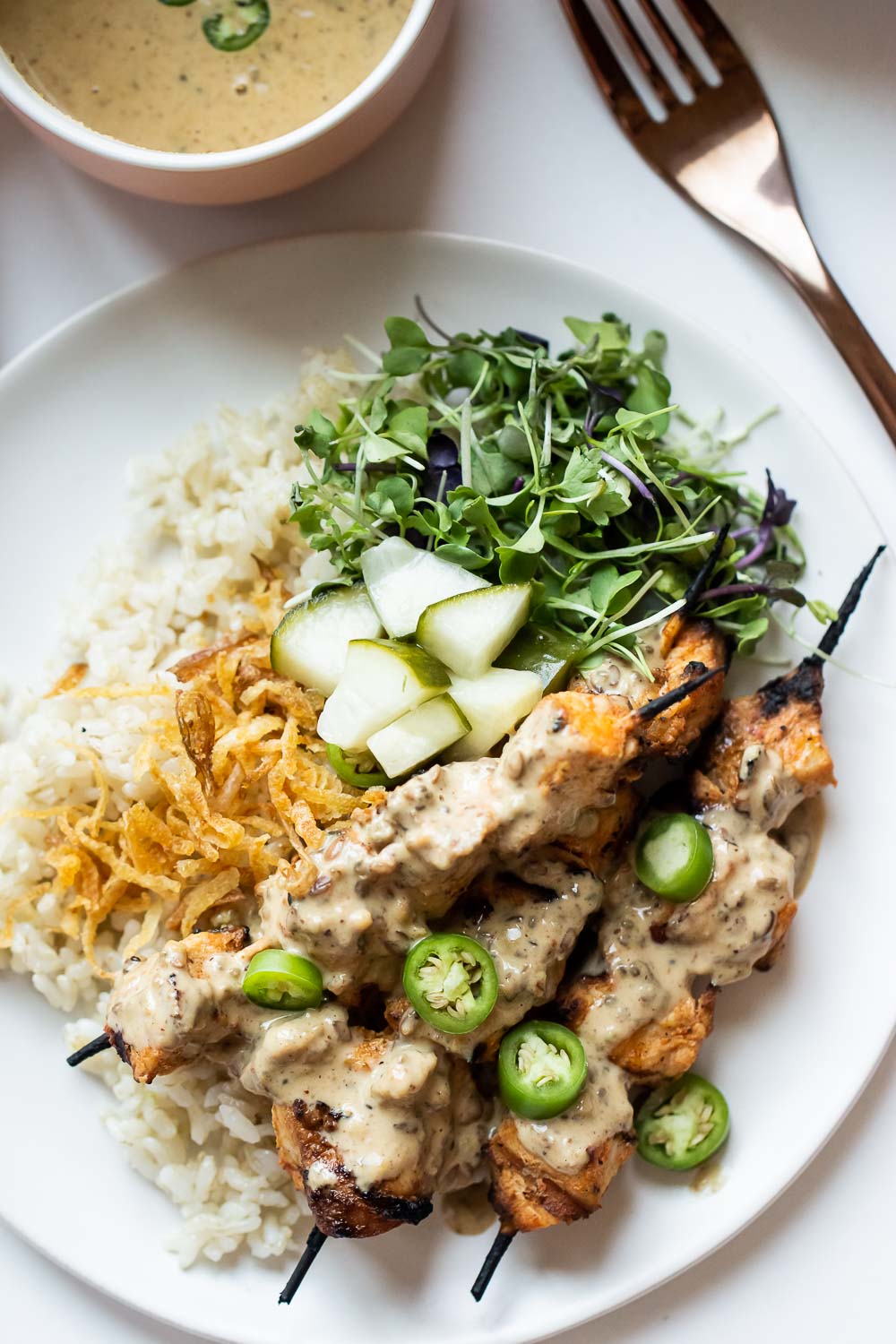 This Chicken Satay Bowl is easy to make and packs in a ton of flavor! Healthy and filling - all in one delicious bite!