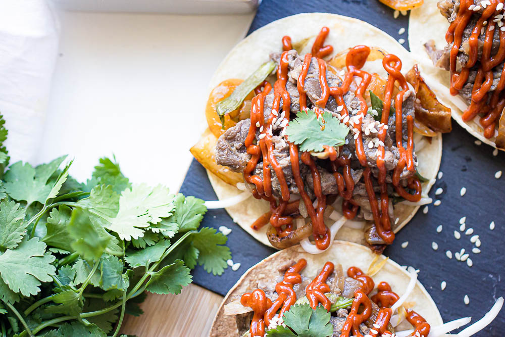 Slow Cooker Beef Tacos or Bulgogi Tacos are packed with flavor, no messy cleanup, and zero effort! Seriously, it doesn't get easier than that! And the best part, you can make it in a slow cooker or on a grill.