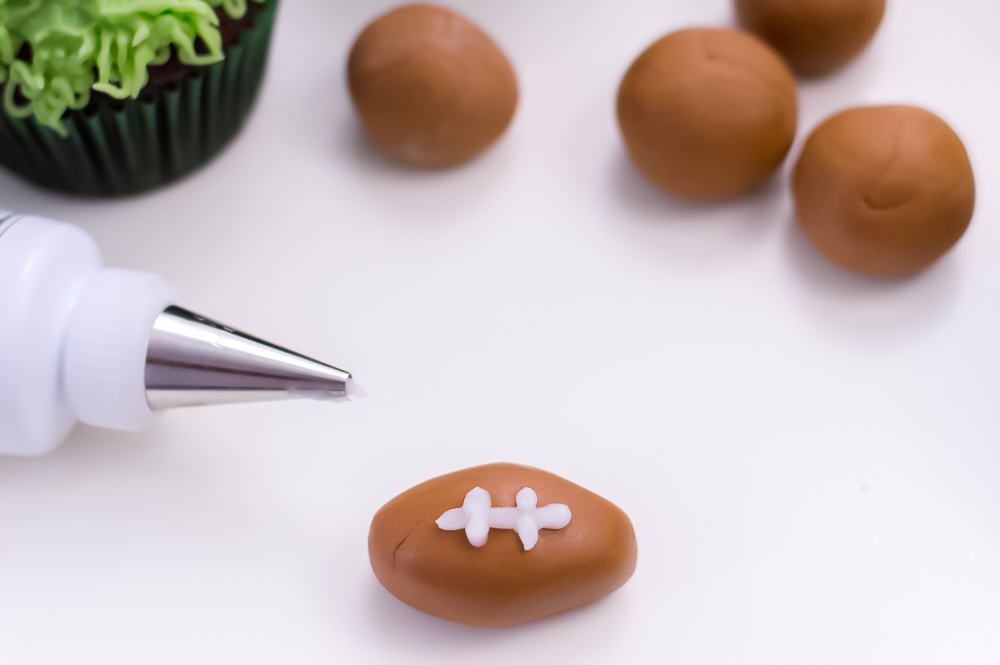 Football Cupcakes are the perfect dessert for Super Bowl parties, football game day, or a themed football birthday party!