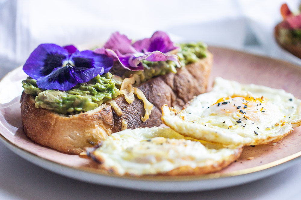 Upgrade your avocado toast to this Avocado Toast Grilled Cheese. Creamy avocado over buttery garlic bread and melted cheese. This toast is so simple to make but brings out the most amazing flavors in every bite.