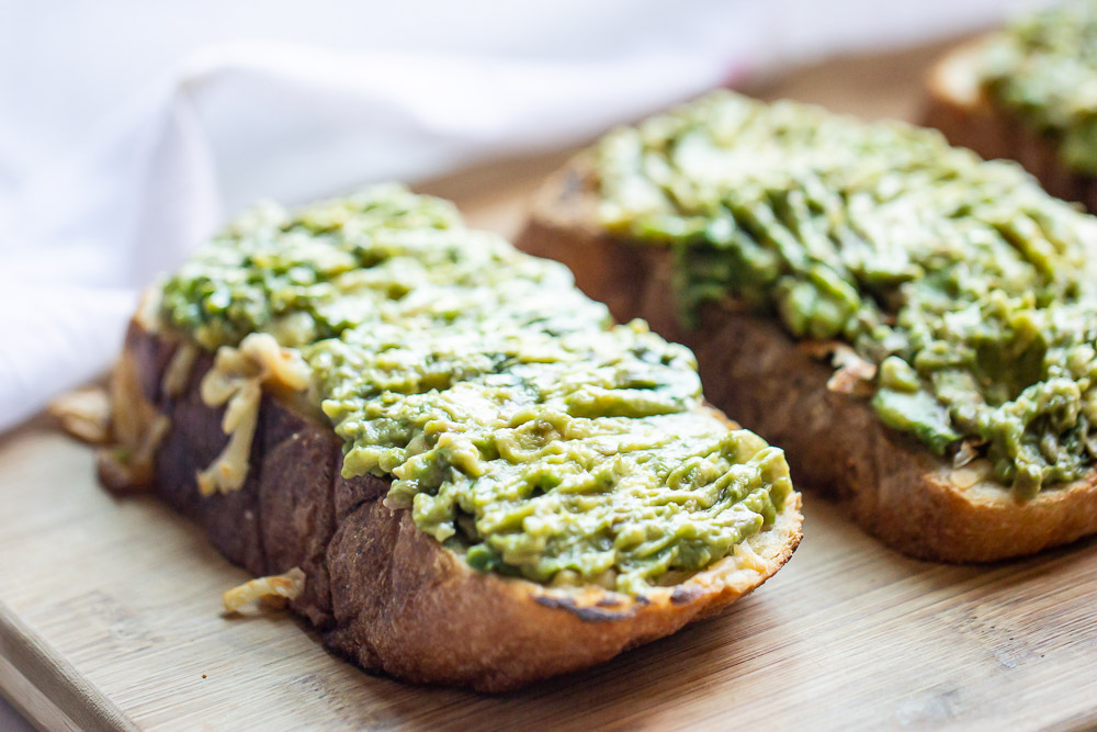 Upgrade your avocado toast to this Avocado Toast Grilled Cheese. Creamy avocado over buttery garlic bread and melted cheese. This toast is so simple to make but brings out the most amazing flavors in every bite.