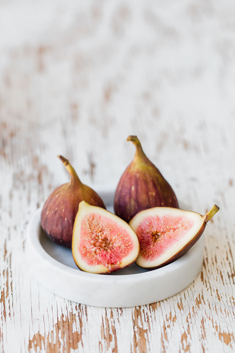 Easy Fluffy Fig Pancakes. So incredibly fluffy, tender and crisp in all the right places with a pile of fresh fruit and maple syrup for the ultimate breakfast.