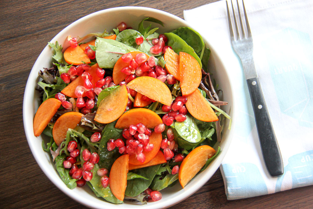 Persimmon Pomegranate Salad. A delicious Fall-inspired salad with all the vibrant and colorful parts of the season combined into one tasty salad.