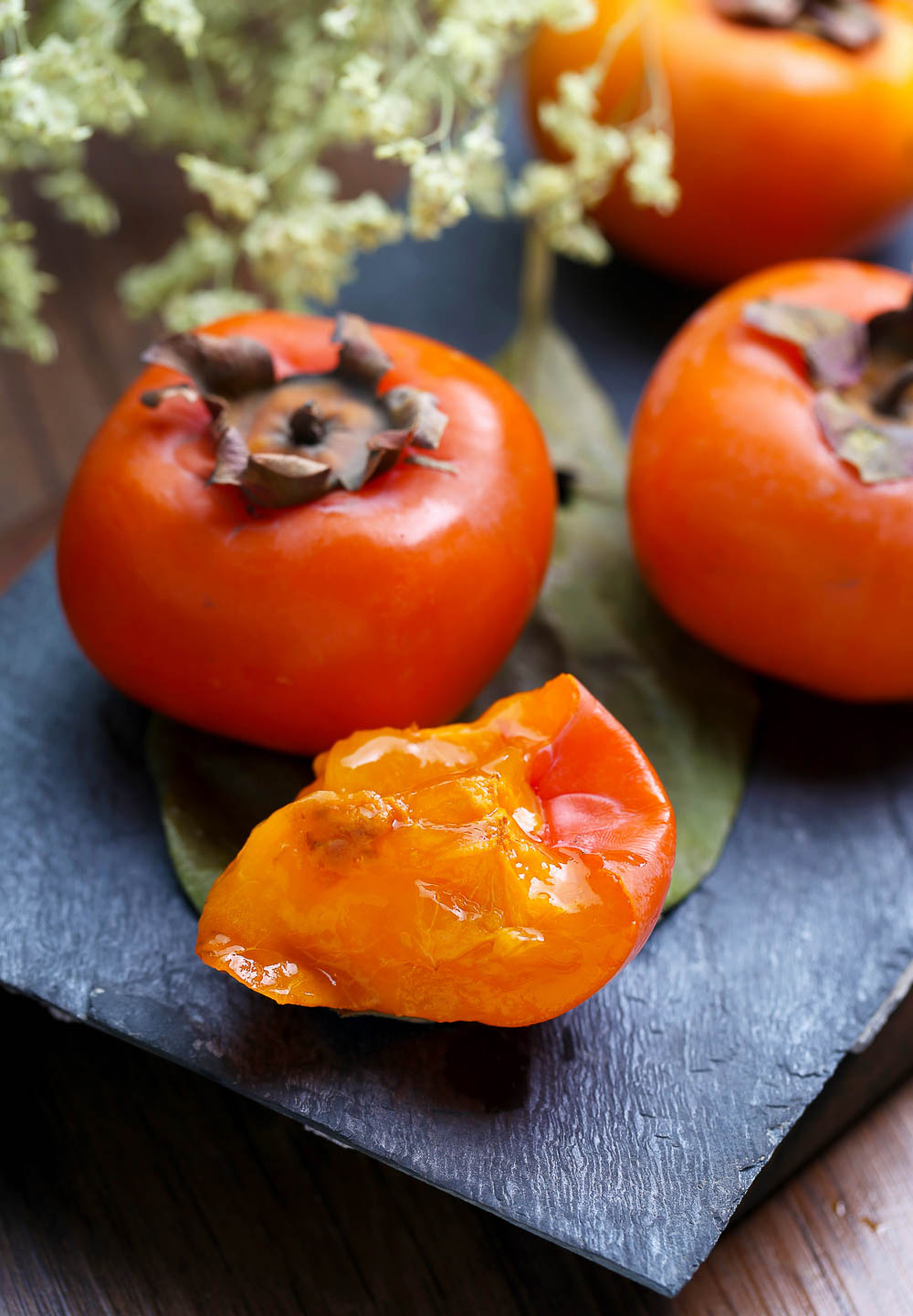 Persimmon Pomegranate Salad. A delicious Fall-inspired salad with all the vibrant and colorful parts of the season combined into one tasty salad.