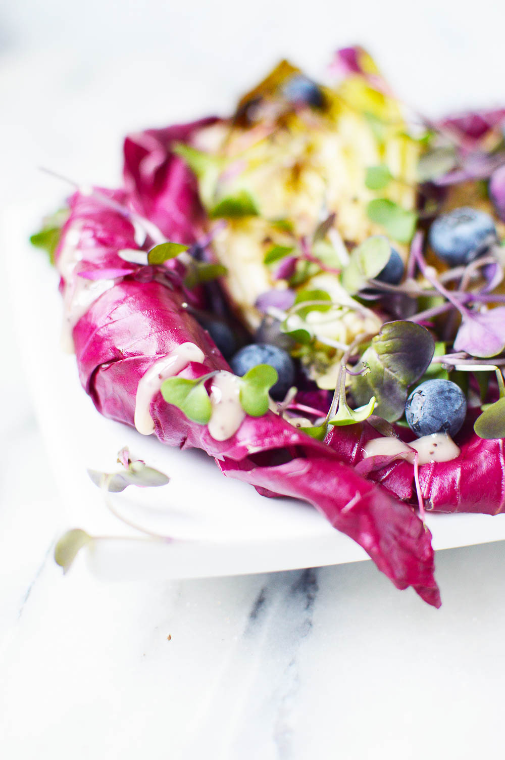 This Radicchio and Endive Salad with Fresh Berries balances bitter flavors with sweetness from berries. So fresh, refreshing, and colorful! Enjoy with a lean protein for a healthy meal.