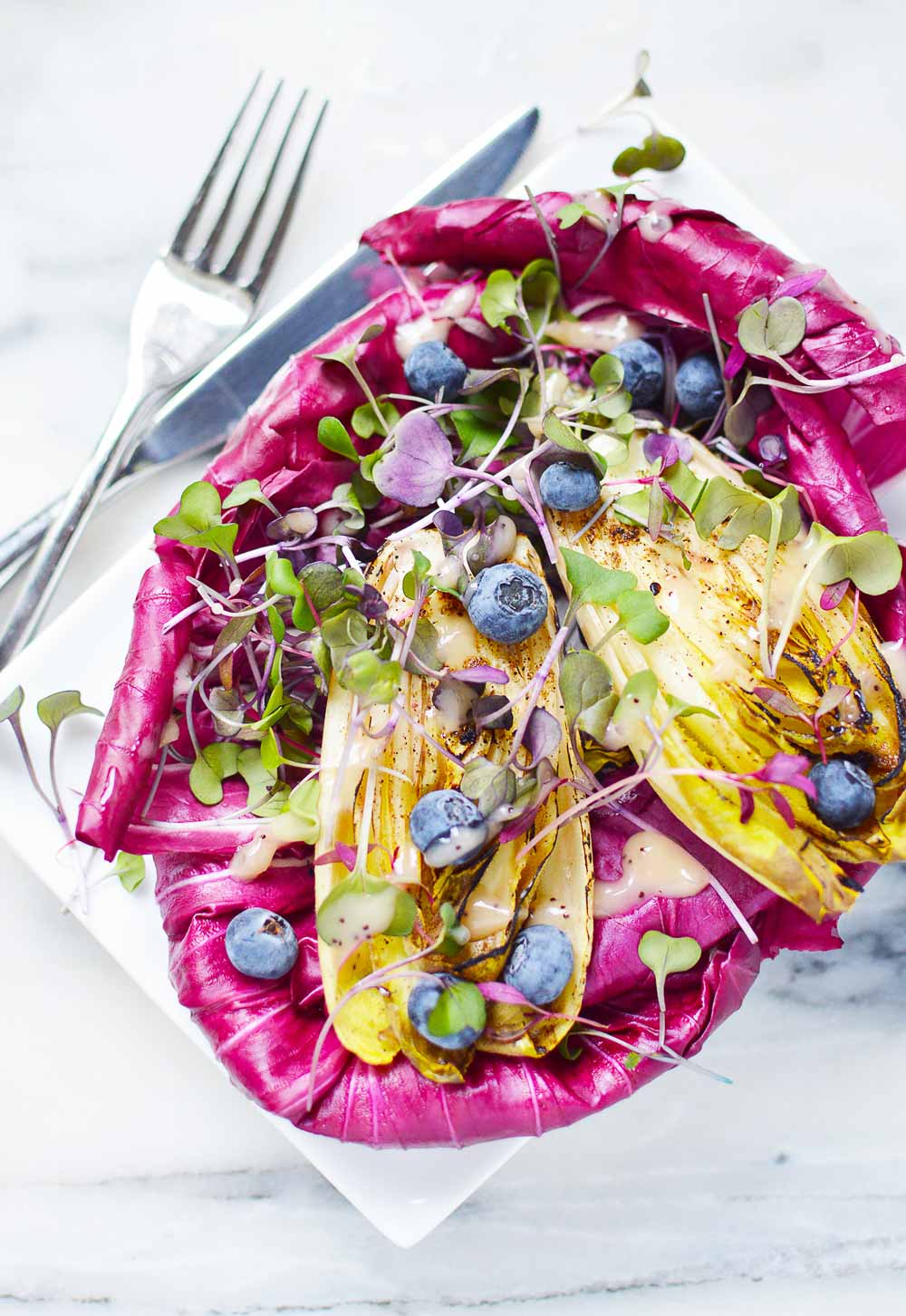 This Radicchio and Endive Salad with Fresh Berries balances bitter flavors with sweetness from berries. So fresh, refreshing, and colorful! Enjoy with a lean protein for a healthy meal.