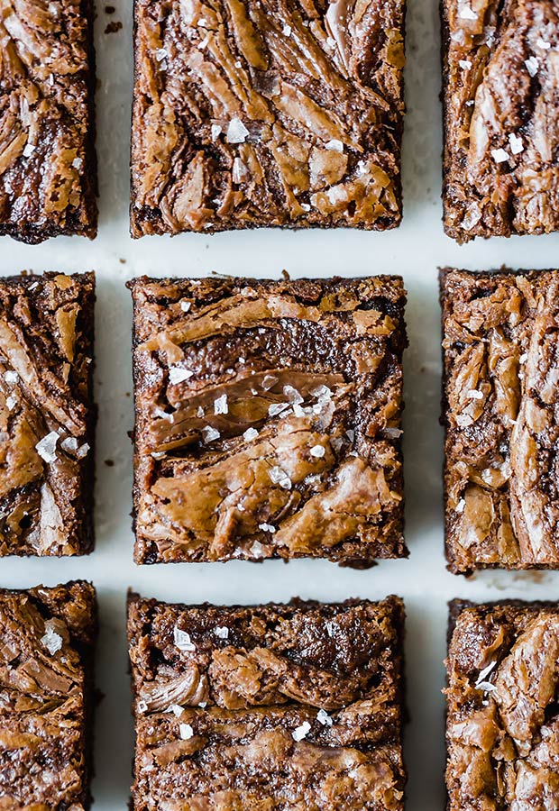 Nutella Brownies that do NOT disappoint! These Nutella Brownies are packed with Nutella and melty chocolate chips, providing each bite with complete satisfaction. These brownies will easily become your new favorite dessert!