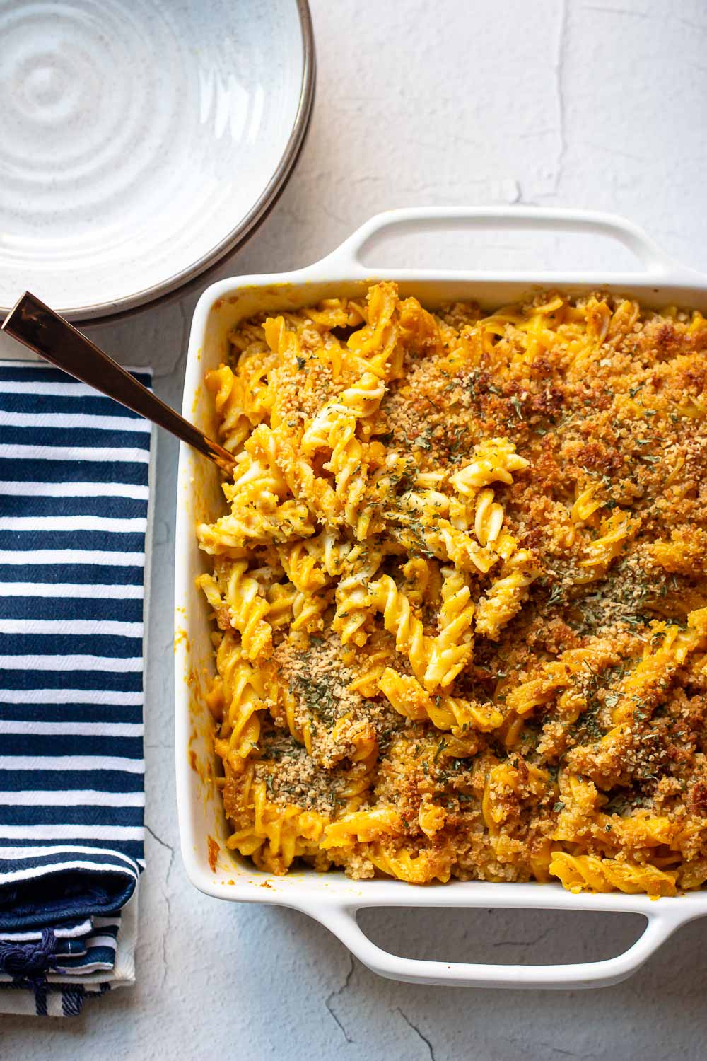 This easy pumpkin mac and cheese recipe is a must-try recipe! Pumpkin puree adds a taste of sweet and savory and creaminess to this cheesy macaroni. The perfect fall dinner!