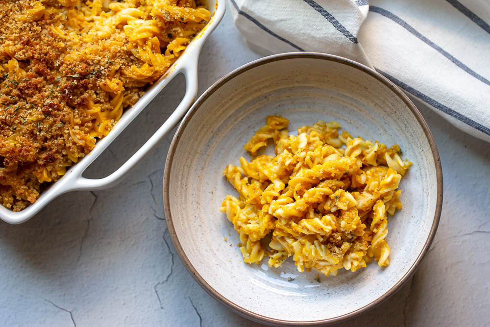This easy pumpkin mac and cheese recipe is a must-try recipe! Pumpkin puree adds a taste of sweet and savory and creaminess to this cheesy macaroni. The perfect fall dinner!