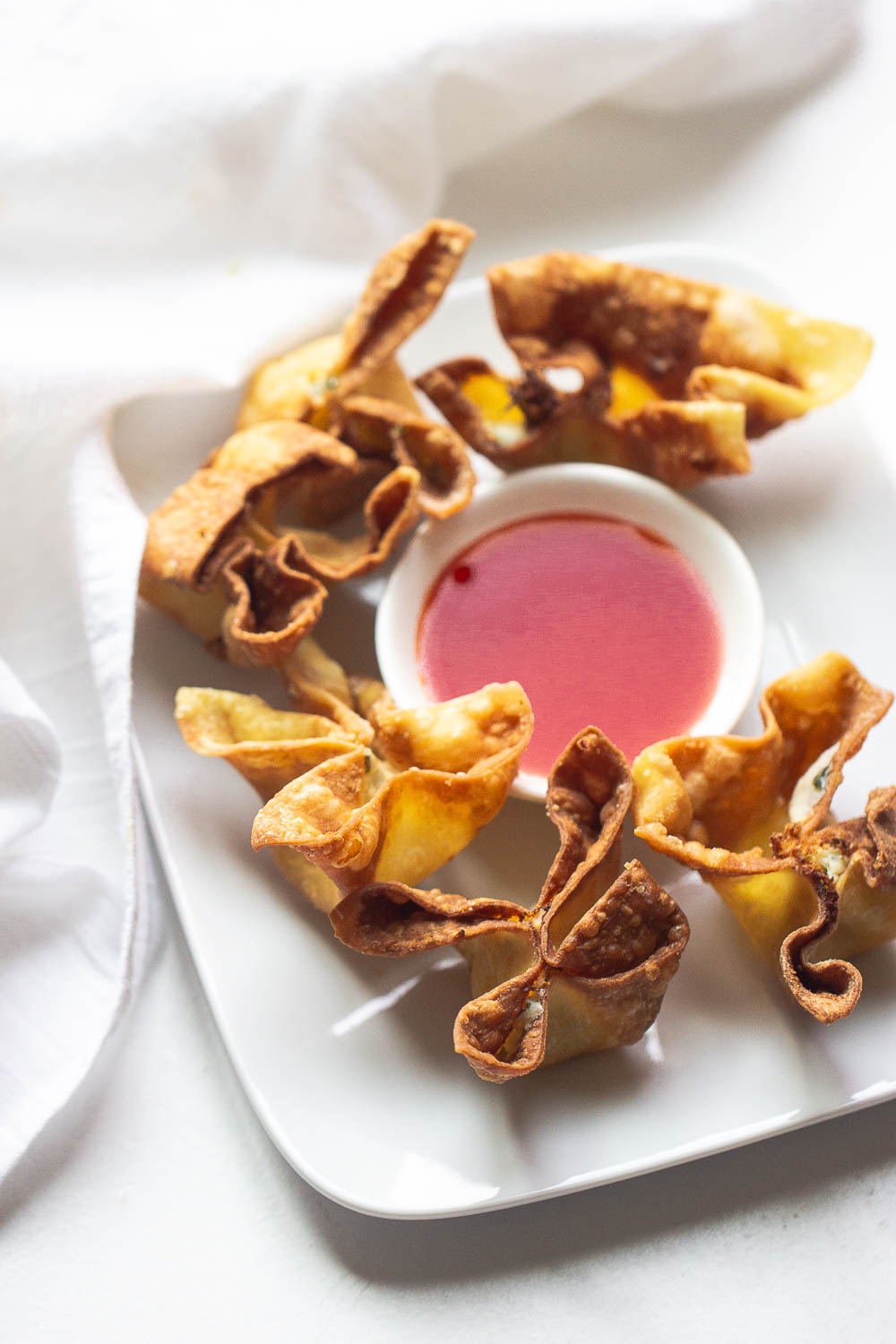 These creamy cream cheese and crab rangoons are so easy to make at home. A fake-out take-out favorite and perfect for snacking on game days!