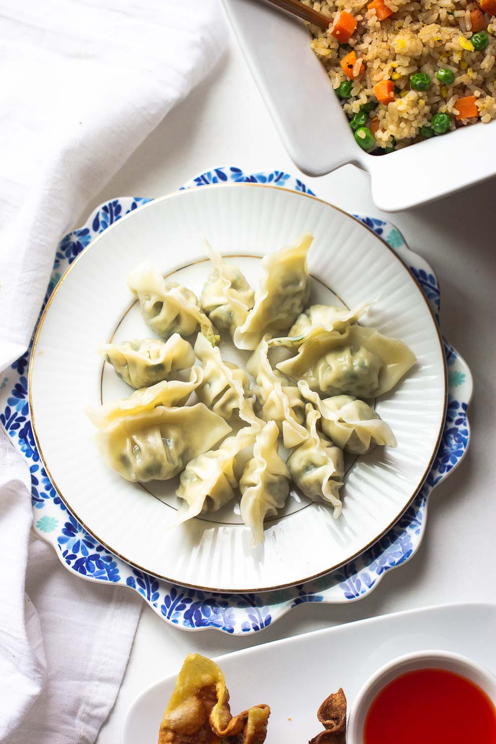 Homemade pork and cabbage potstickers (guotie, jiaozi) are more fun and you will never buy take out again after seeing the video on how these are made.