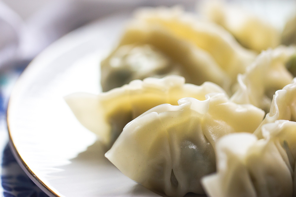 Homemade pork and cabbage potstickers (guotie, jiaozi) are more fun and you will never buy take out again after seeing the video on how these are made.