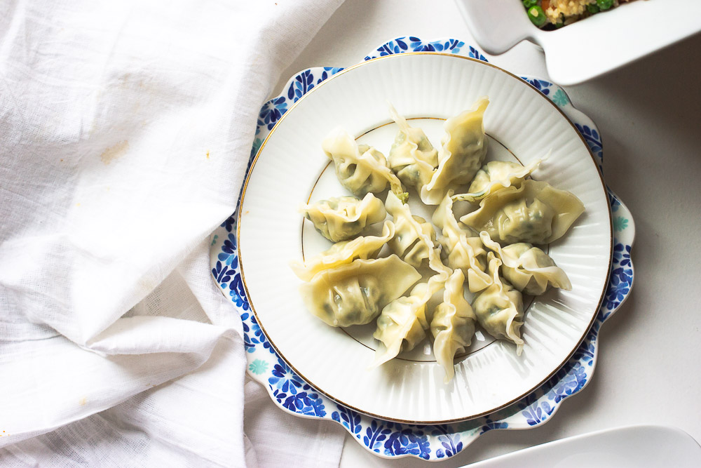 Homemade pork and cabbage potstickers (guotie, jiaozi) are more fun and you will never buy take out again after seeing the video on how these are made.