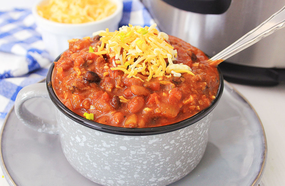 Three Bean Chili is a delicious weeknight meal and awesome as leftovers. Made in an Instant Pot in less than 30 minutes, this chili is hearty, full of flavor, and easy to make.