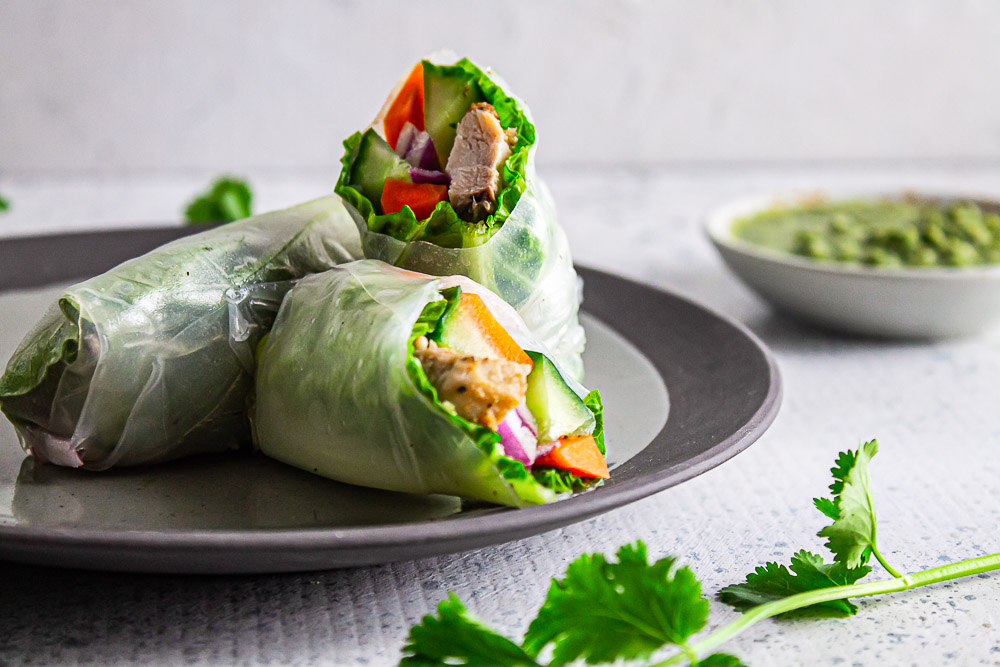 Homemade Chicken Spring Rolls with Cilantro Sauce is easy to make, refreshing, and make a delicious lunch, dinner, or snack on-the-go.