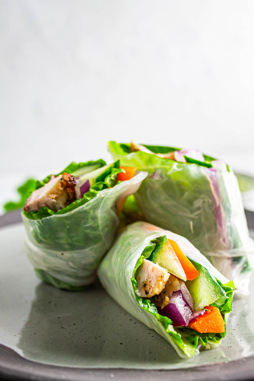 Homemade Chicken Spring Rolls with Cilantro Sauce is easy to make, refreshing, and make a delicious lunch, dinner, or snack on-the-go.