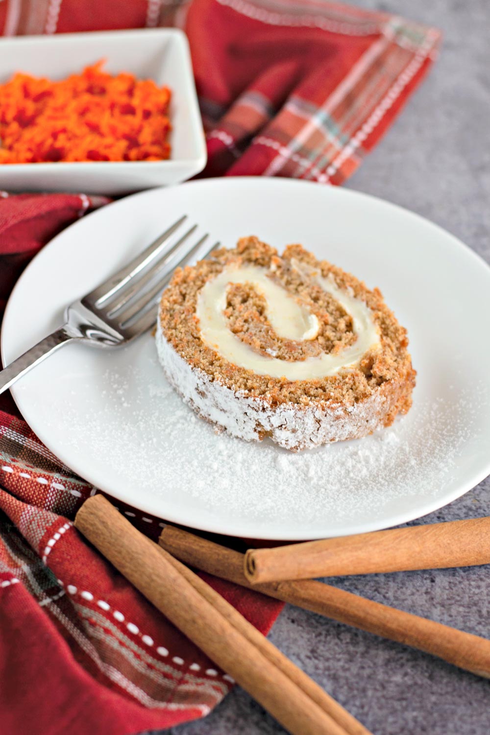 This Carrot Cake Roll is a must-try recipe. It is super-delicious, perfectly-spiced, moist, ultra-creamy, and makes a delicious dessert!